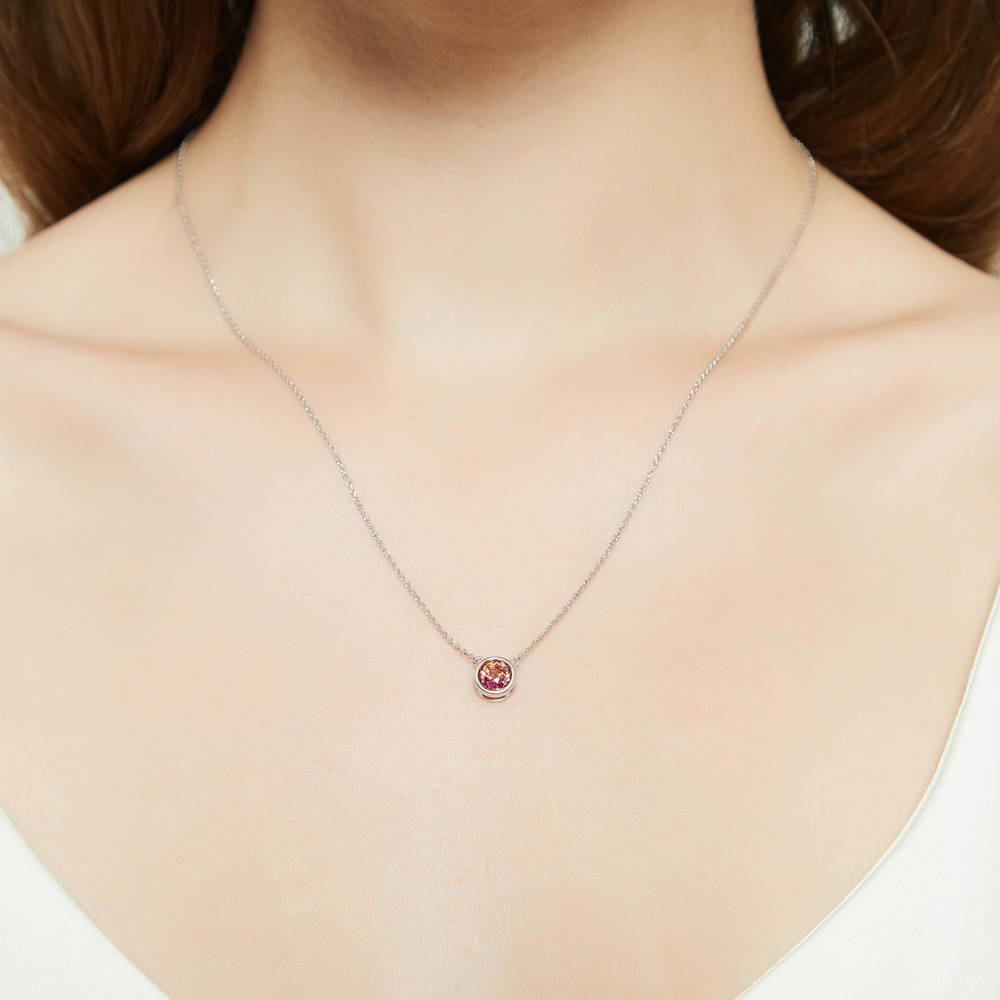 Model wearing Solitaire Bezel Set Round CZ Pendant Necklace in Sterling Silver 0.8ct, 8 of 16