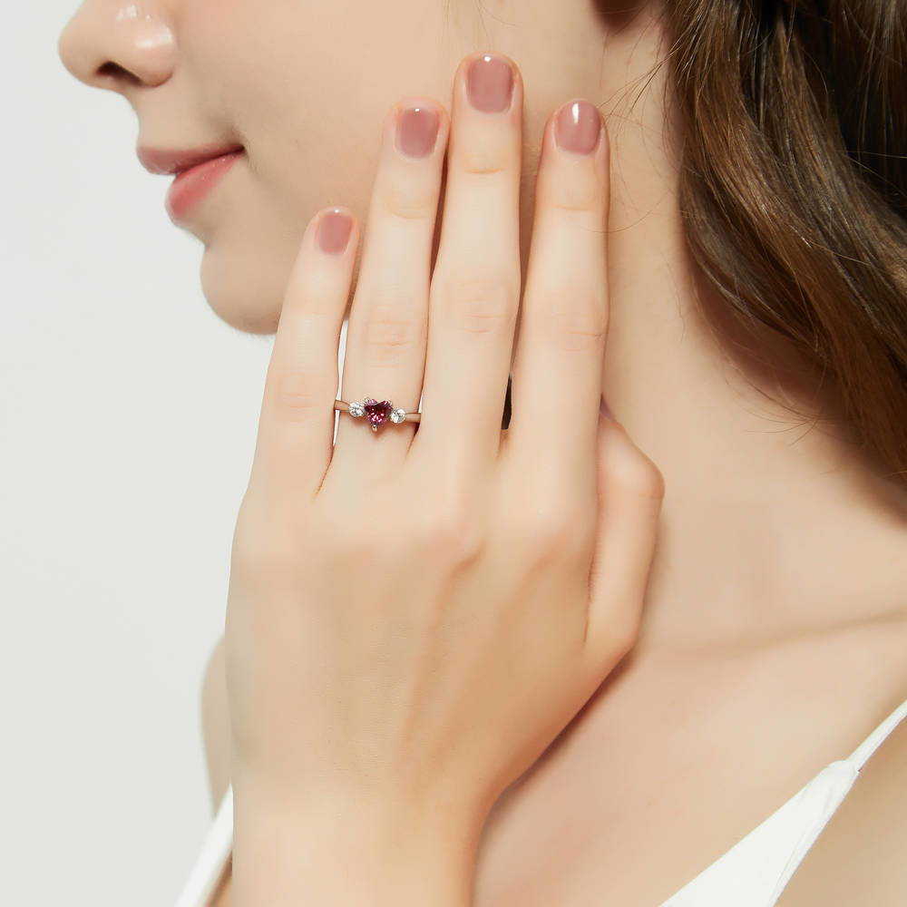 Model wearing 3-Stone Heart Red CZ Ring in Sterling Silver