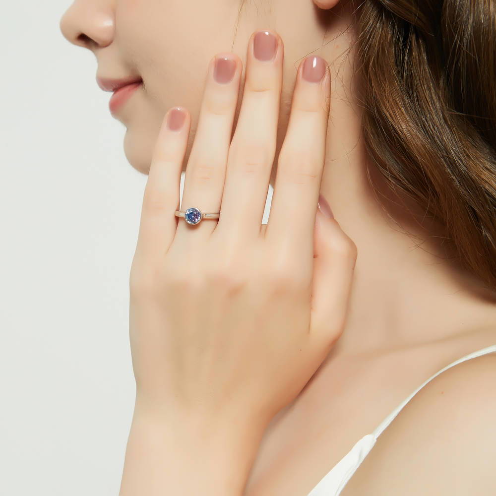 Model wearing Solitaire Purple Aqua Bezel Set Round CZ Ring in Sterling Silver 0.8ct, 3 of 9
