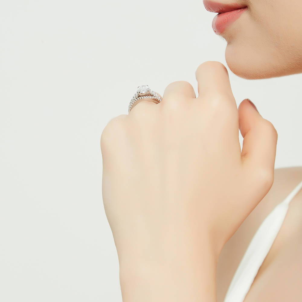 Model wearing Solitaire 2.7ct Oval CZ Split Shank Ring Set in Sterling Silver, 8 of 17