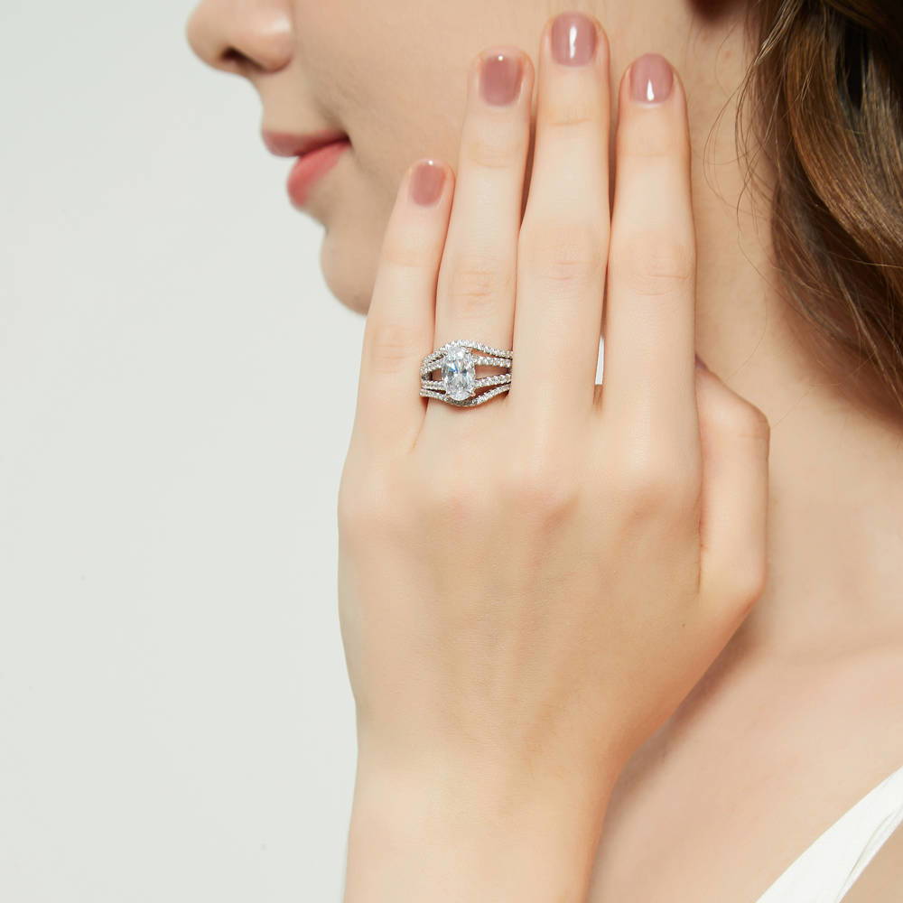 Model wearing Solitaire 2.7ct Oval CZ Split Shank Ring Set in Sterling Silver, 5 of 17