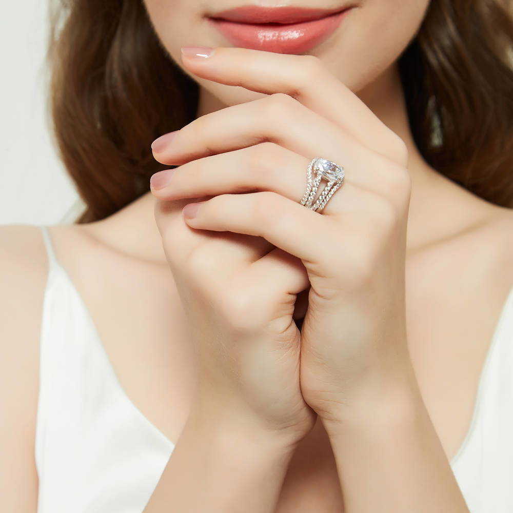 Model wearing Solitaire 2.7ct Oval CZ Split Shank Ring Set in Sterling Silver, 6 of 17