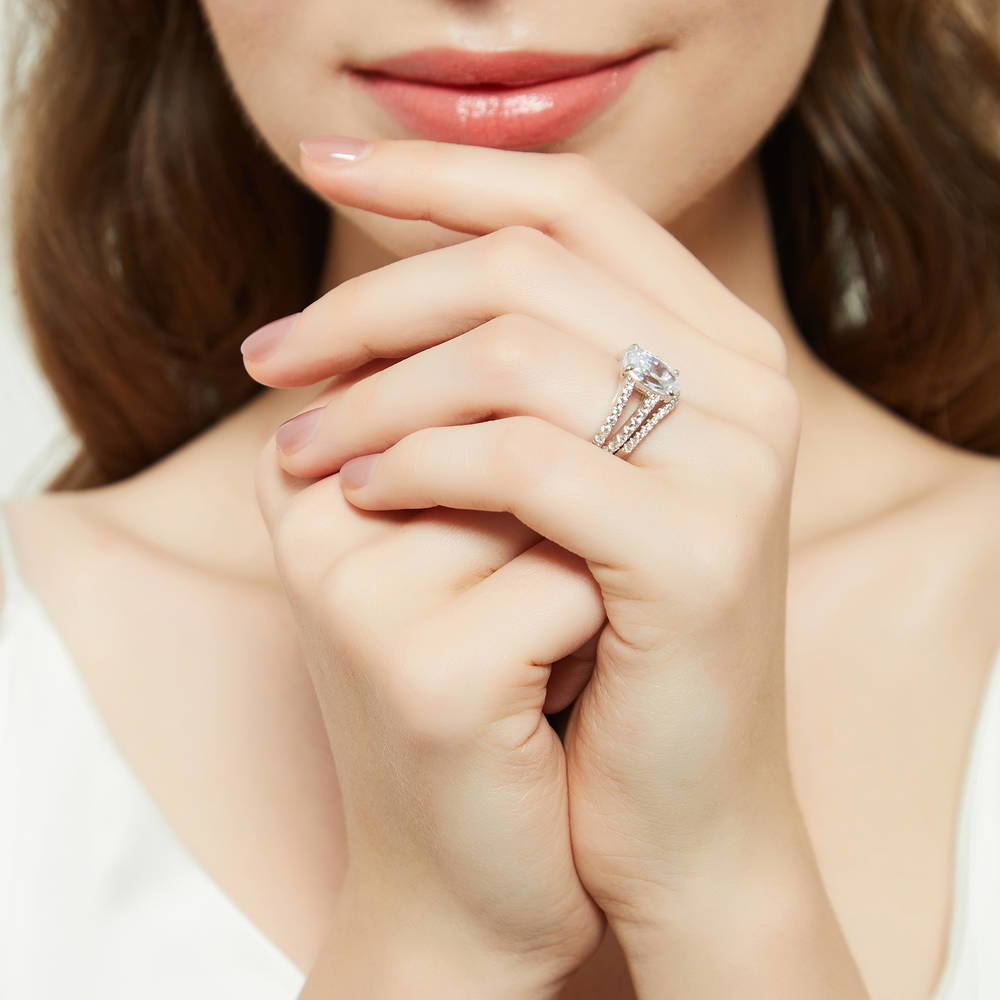 Model wearing Solitaire 2.7ct Oval CZ Split Shank Ring Set in Sterling Silver, 6 of 17