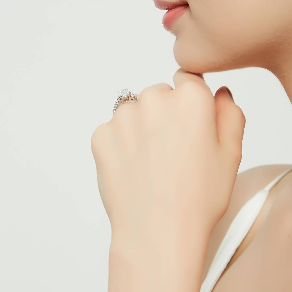 Model wearing Solitaire 2.7ct Oval CZ Split Shank Ring in Sterling Silver, 7 of 9