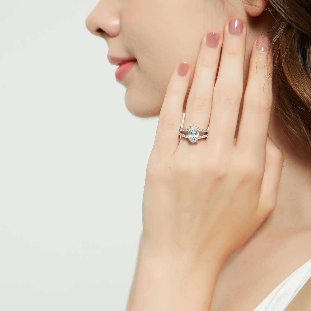 Model wearing Solitaire 2.7ct Oval CZ Split Shank Ring in Sterling Silver, 3 of 9