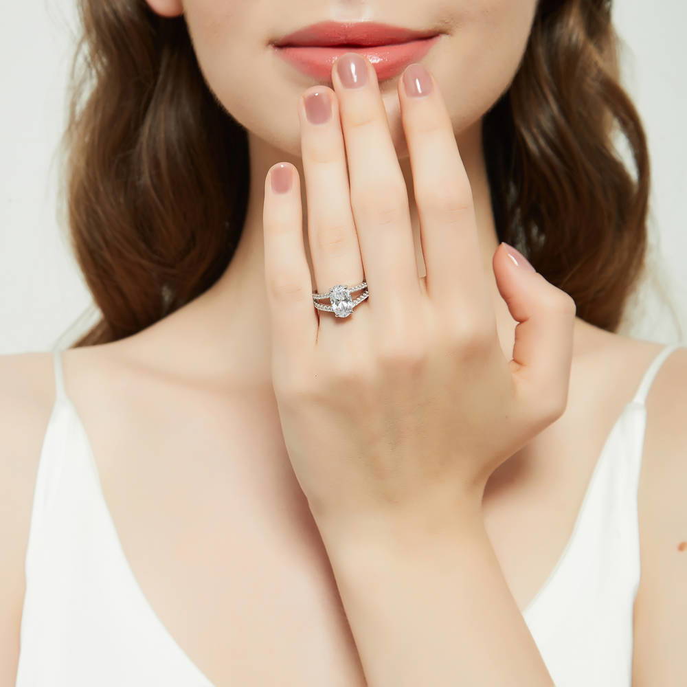 Model wearing Solitaire 2.7ct Oval CZ Split Shank Ring in Sterling Silver, 2 of 9
