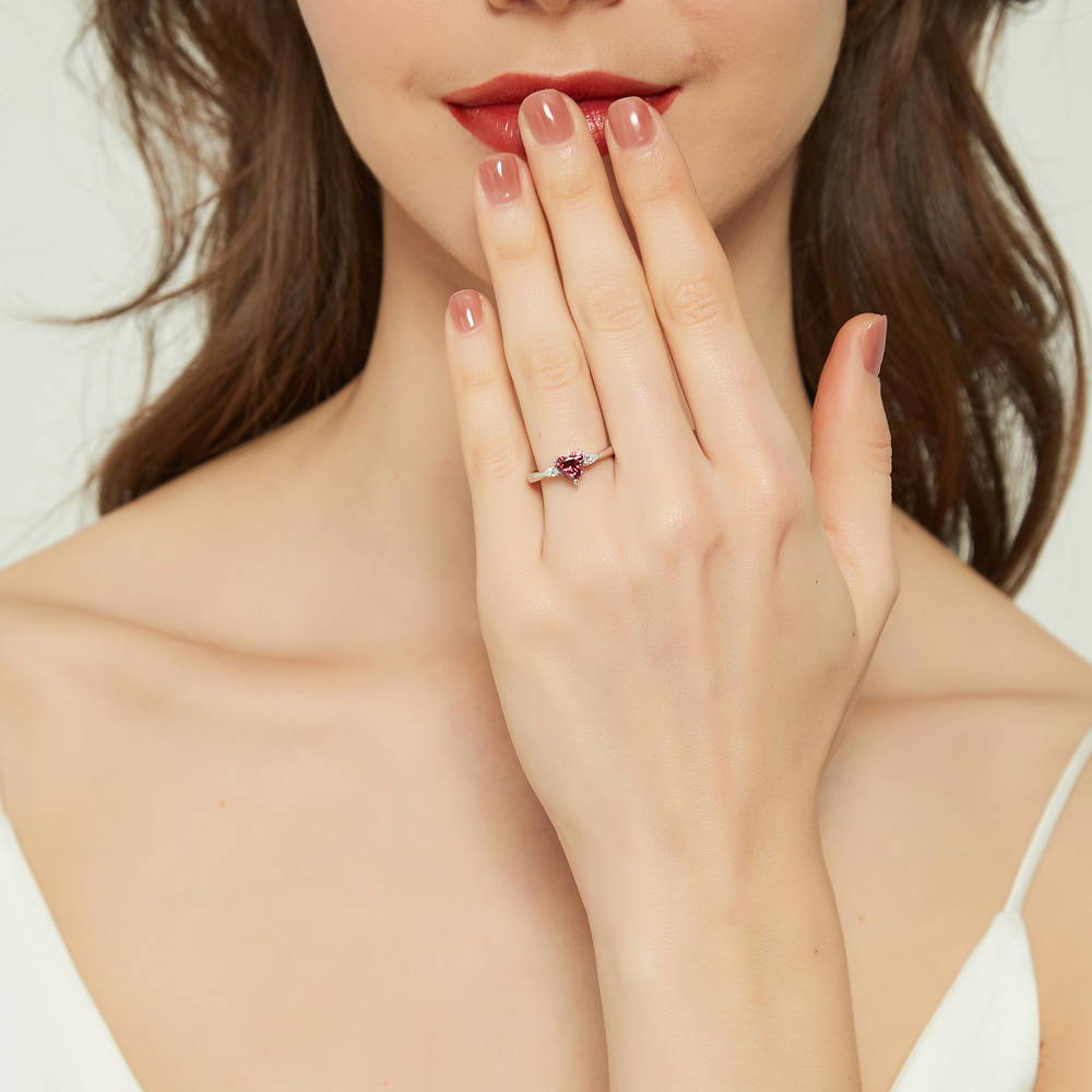Model wearing 3-Stone Heart Red CZ Ring in Sterling Silver, 2 of 9