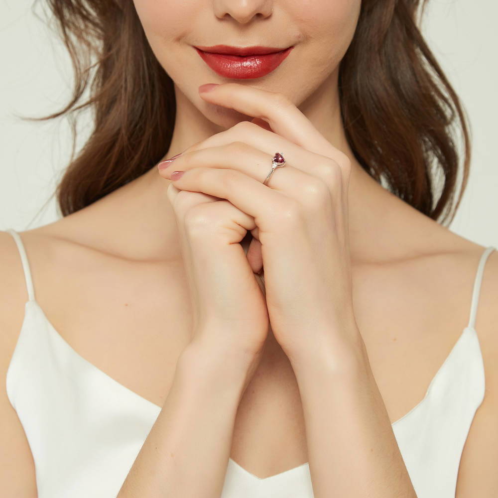 Model wearing 3-Stone Heart Red CZ Ring in Sterling Silver, 6 of 9