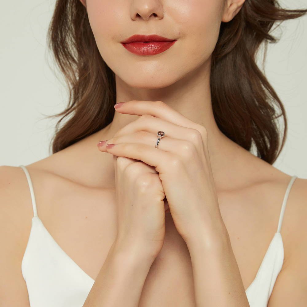Model wearing Solitaire 0.8ct Caramel Bezel CZ Ring Set in Sterling Silver, 7 of 11