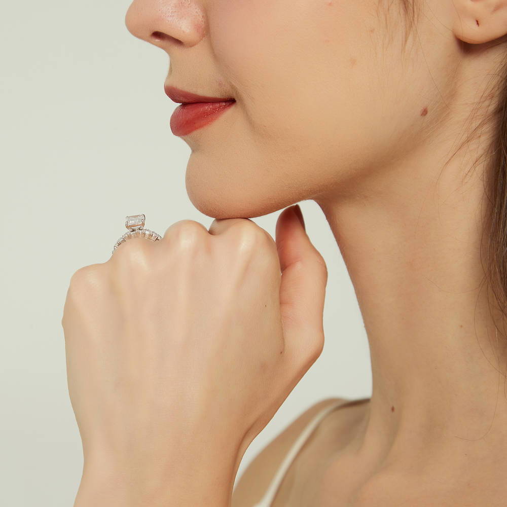 Model wearing Solitaire Art Deco Emerald Cut CZ Ring Set in Sterling Silver, 9 of 19