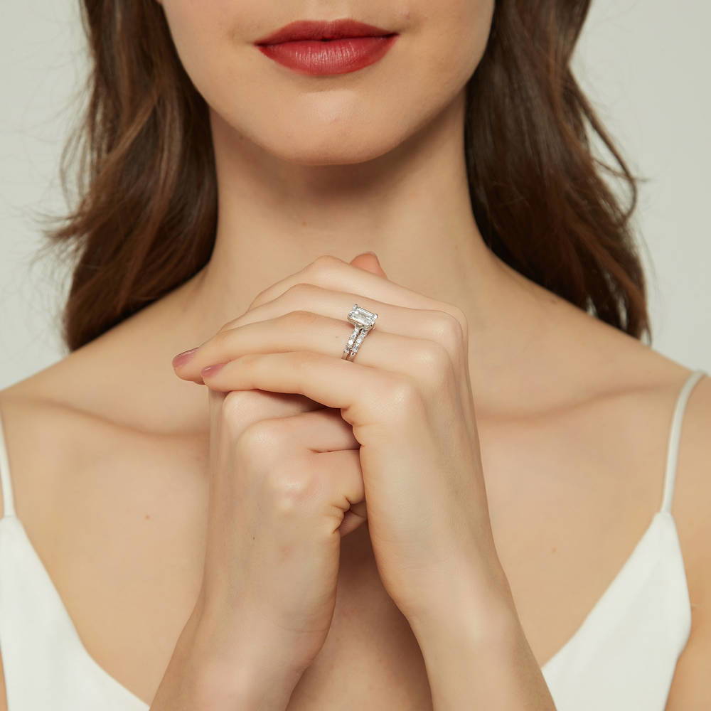 Model wearing Solitaire Art Deco 2.1ct Emerald Cut CZ Ring Set in Sterling Silver, 6 of 18