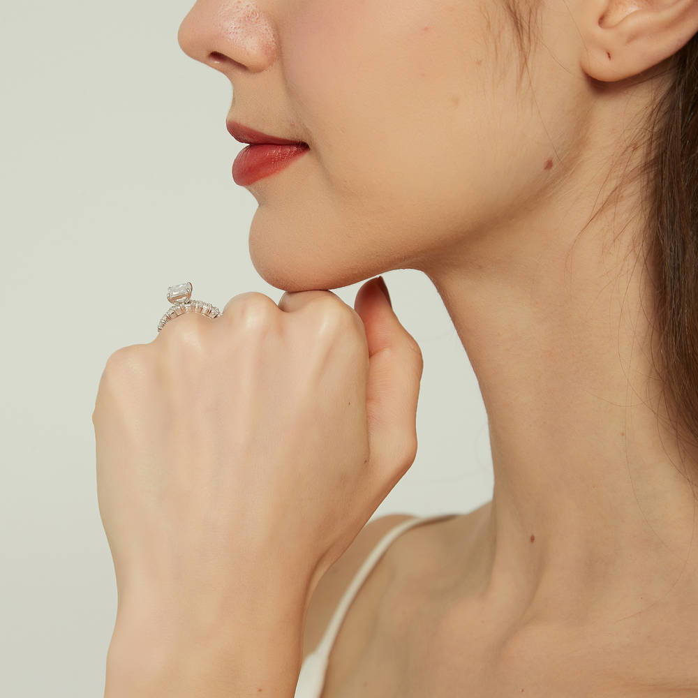 Model wearing Solitaire Art Deco Emerald Cut CZ Ring Set in Sterling Silver, 9 of 18