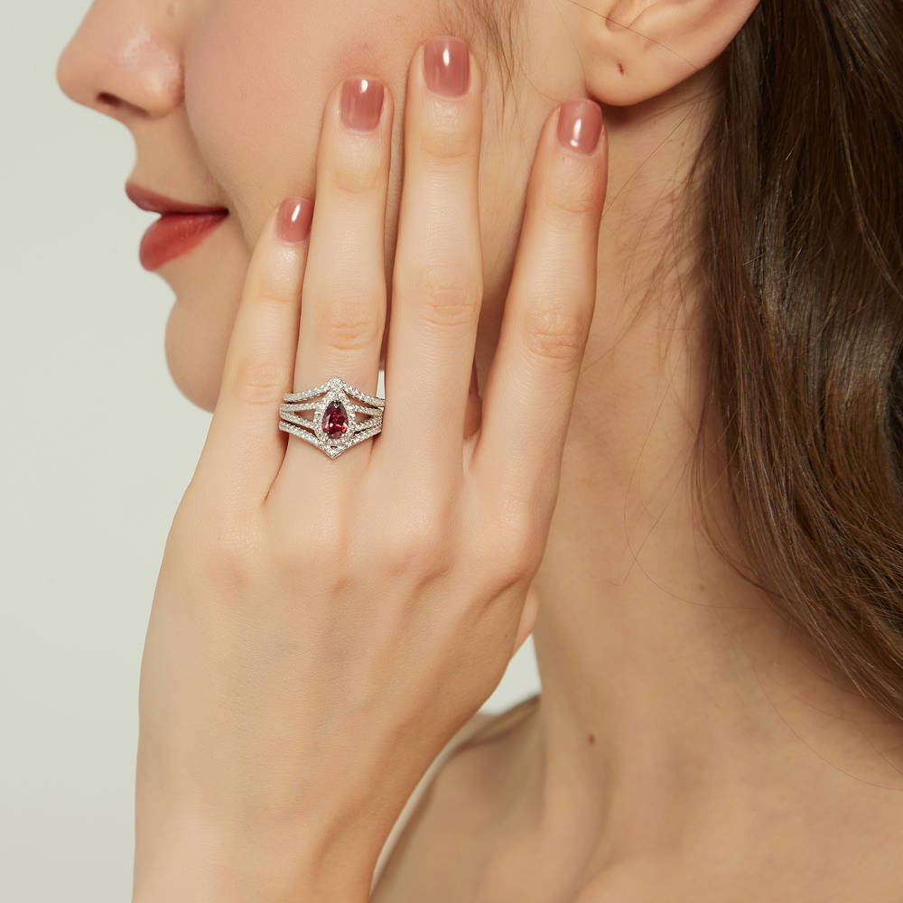 Model wearing Halo Wishbone Red Pear CZ Split Shank Ring Set in Sterling Silver, 2 of 16