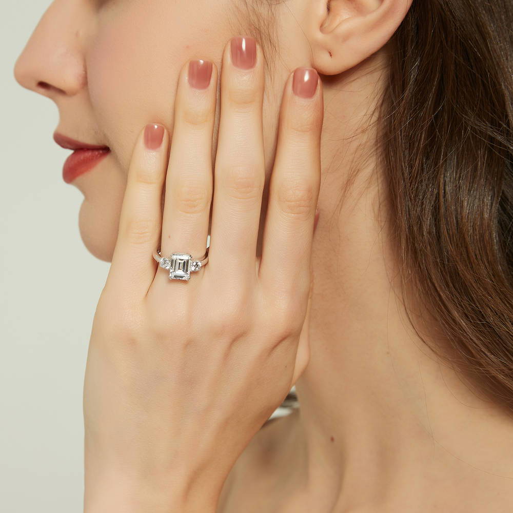 Model wearing 3-Stone 2.6ct Emerald Cut CZ Ring in Sterling Silver, 6 of 14