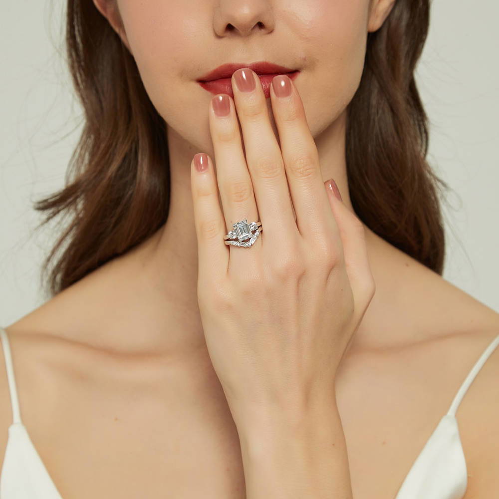 Model wearing 3-Stone 2.6ct Emerald Cut CZ Ring in Sterling Silver, 15 of 20