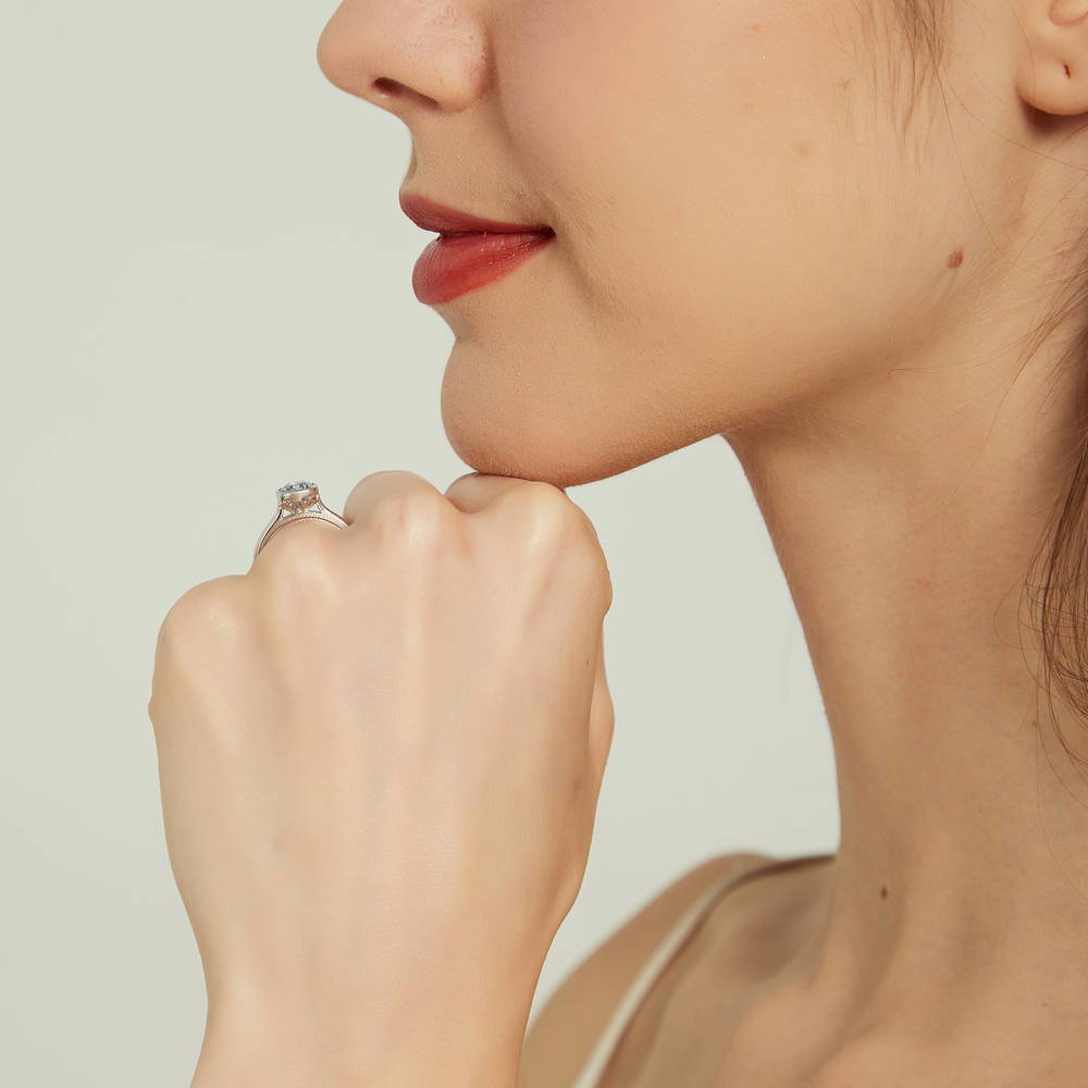 Model wearing Solitaire Kaleidoscope Purple Aqua CZ Ring in Sterling Silver, 7 of 9