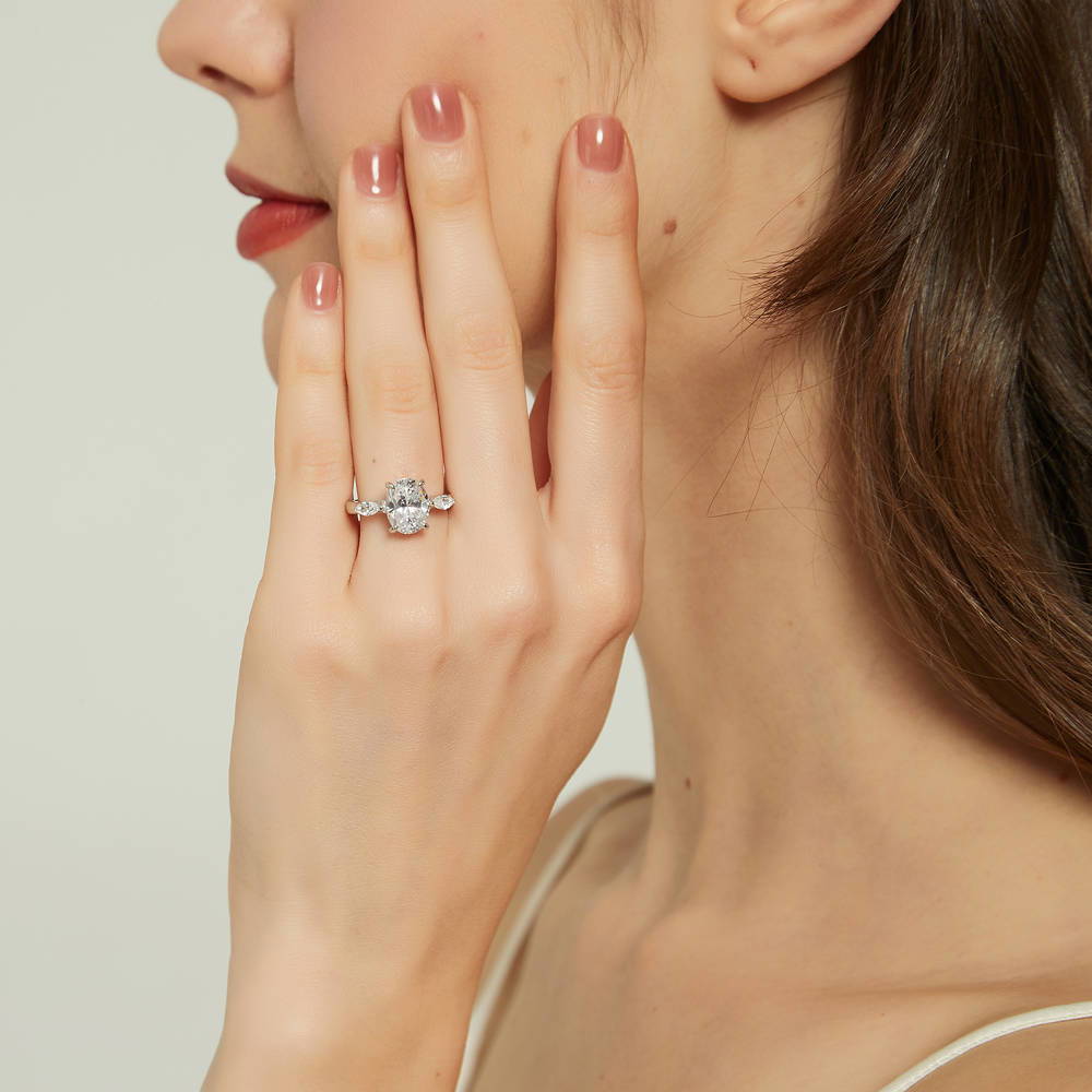 Model wearing 3-Stone 2.5ct Oval CZ Ring in Sterling Silver, 2 of 9