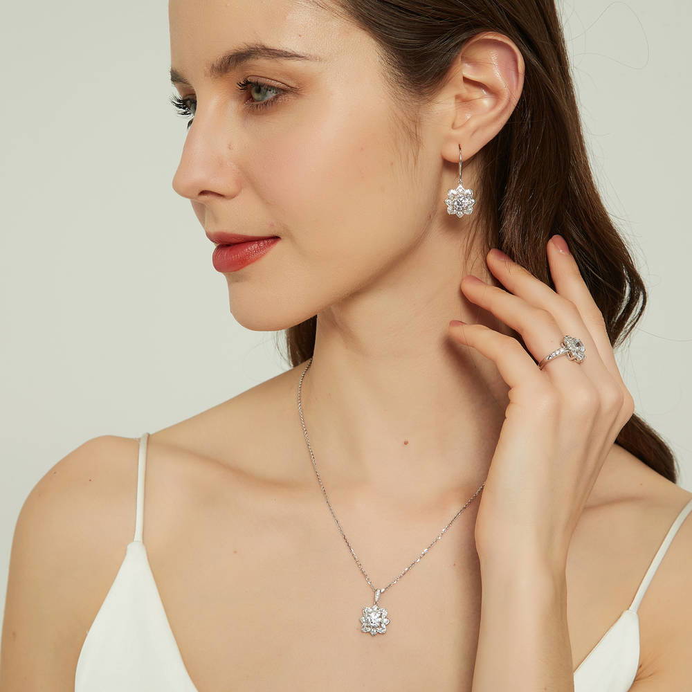 Model wearing Flower Halo CZ Ring in Sterling Silver, 11 of 13