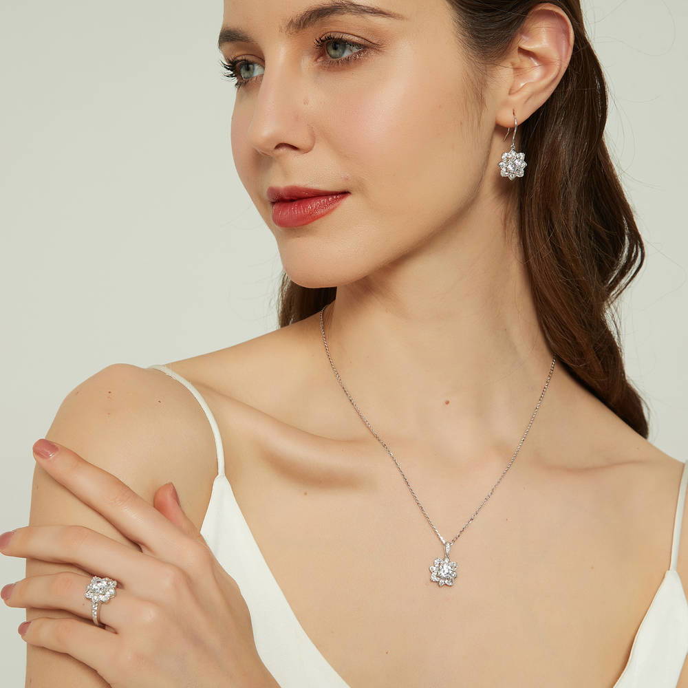 Model wearing Flower Halo CZ Ring in Sterling Silver, 10 of 13