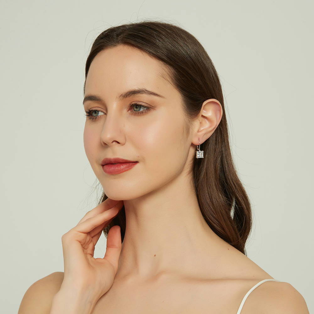 Model wearing Solitaire 6ct Princess CZ Leverback Dangle Earrings in Sterling Silver, 5 of 6