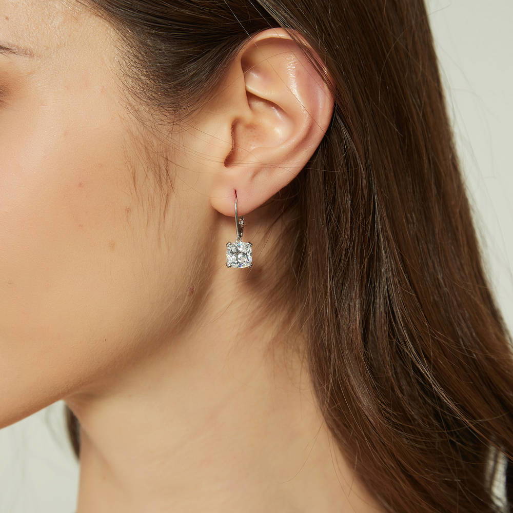 Model wearing Solitaire 6ct Cushion CZ Leverback Dangle Earrings in Sterling Silver, 2 of 6