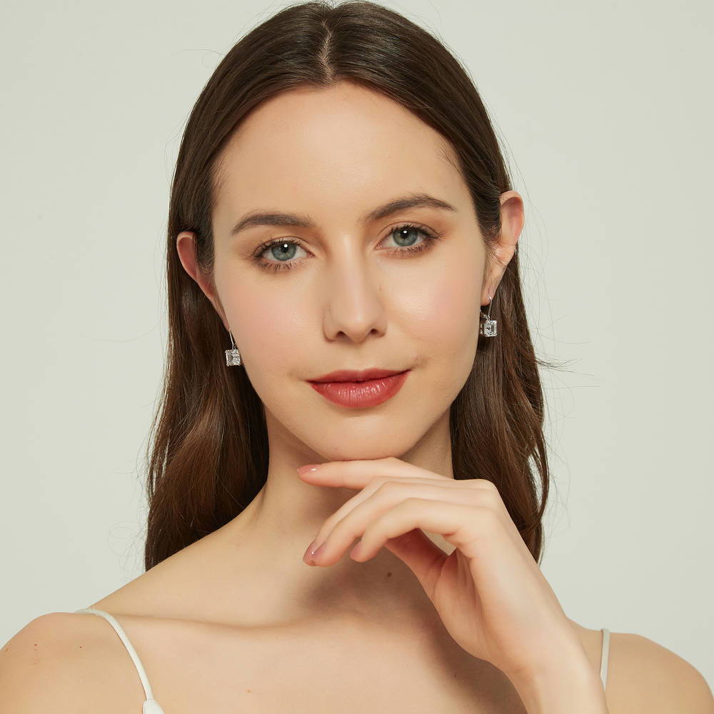 Model wearing Solitaire 6ct Asscher CZ Leverback Earrings in Sterling Silver, 4 of 6
