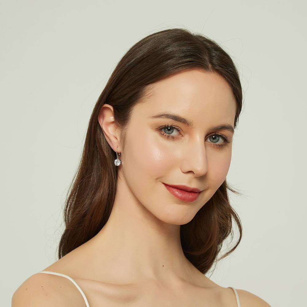 Model wearing Solitaire 4ct CZ Leverback Earrings in Sterling Silver, 4 of 6
