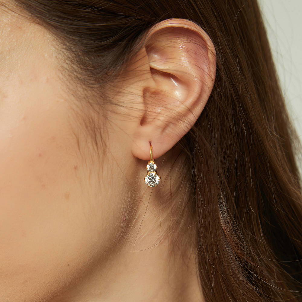 Model wearing 2-Stone CZ Leverback Earrings in Sterling Silver, Yellow Gold Flashed