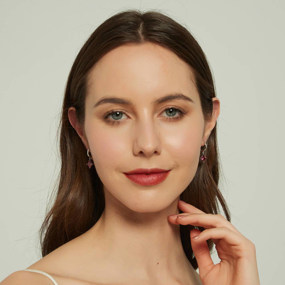 Model wearing Solitaire Red Princess CZ Dangle Earrings in Sterling Silver 2.4ct, 4 of 6
