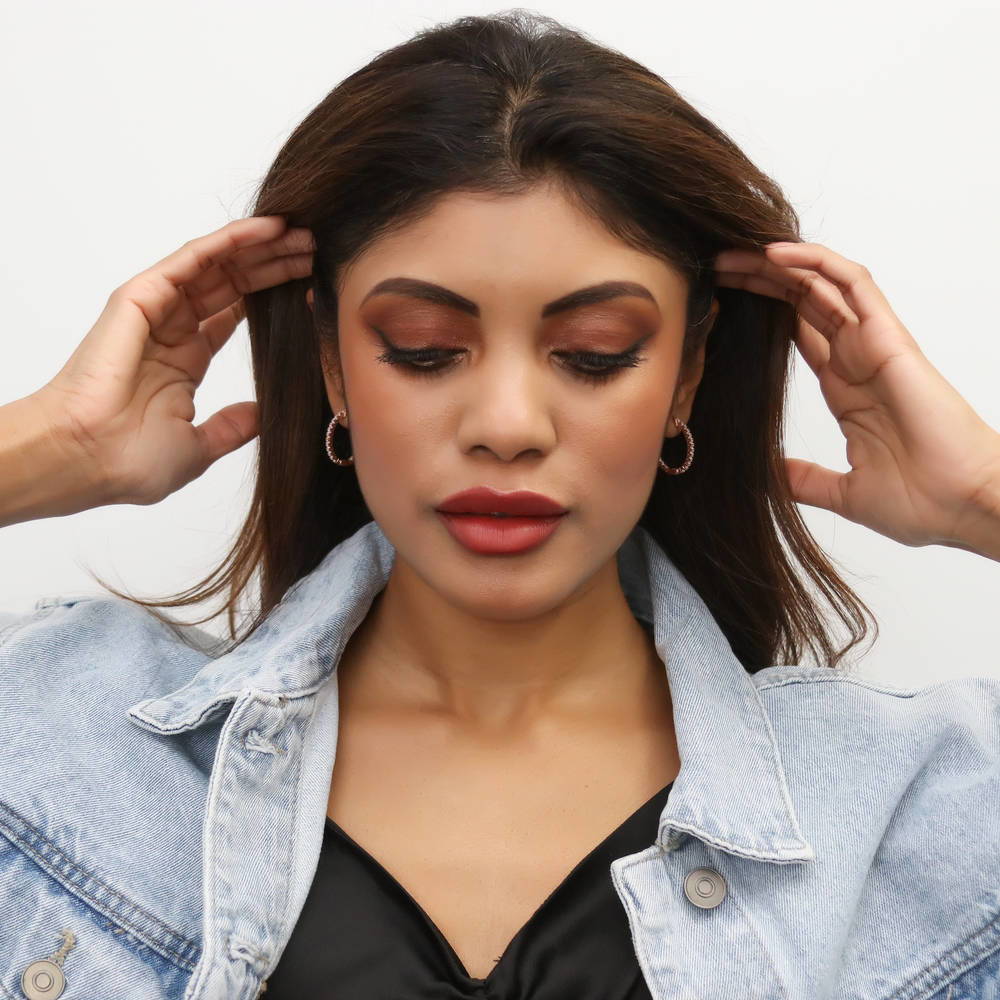 Model wearing Oval CZ Small Inside-Out Hoop Earrings in Sterling Silver 0.8 inch, Rose Gold Flashed