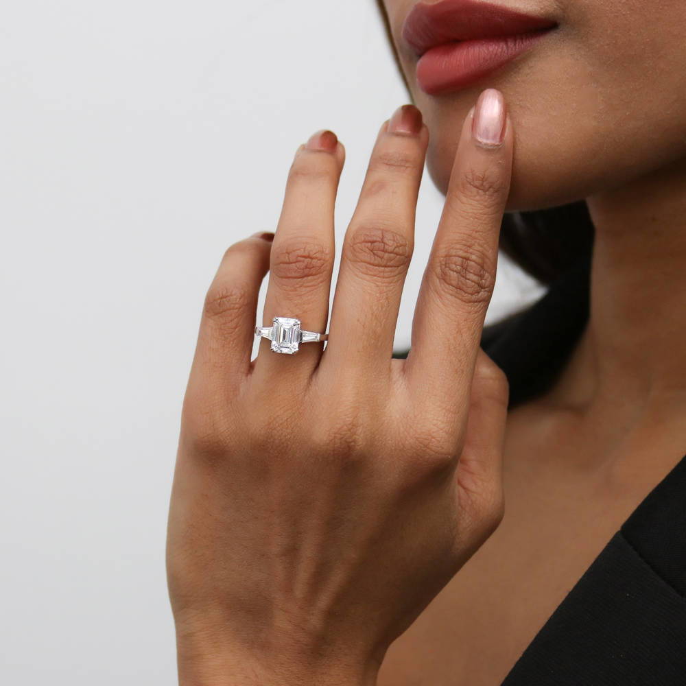 Model wearing 3-Stone Wishbone 2.1ct Emerald Cut CZ Ring Set in Sterling Silver, 19 of 20