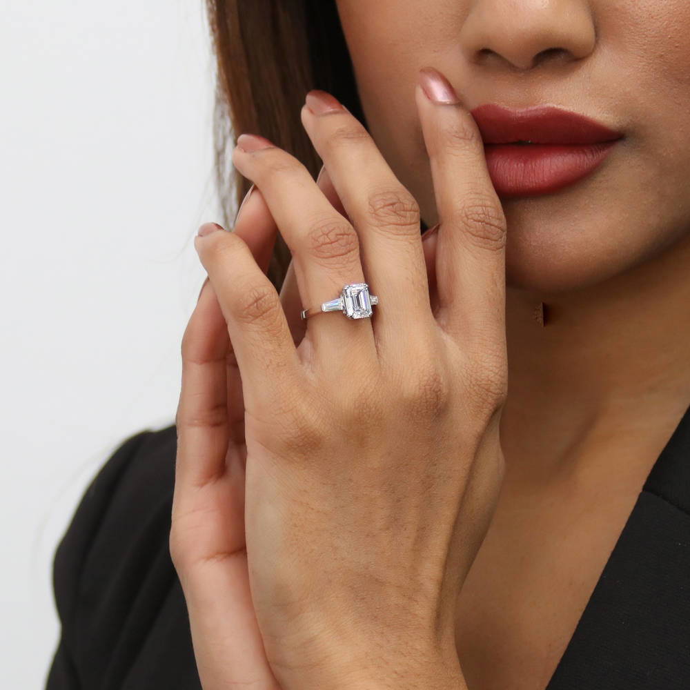 Model wearing 3-Stone Wishbone 2.1ct Emerald Cut CZ Ring Set in Sterling Silver, 15 of 20