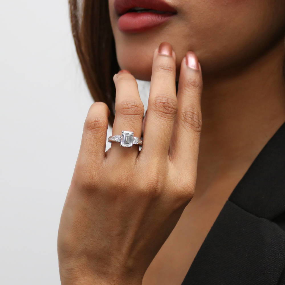 Model wearing 3-Stone 2.1ct Emerald Cut CZ Ring in Sterling Silver, 9 of 10
