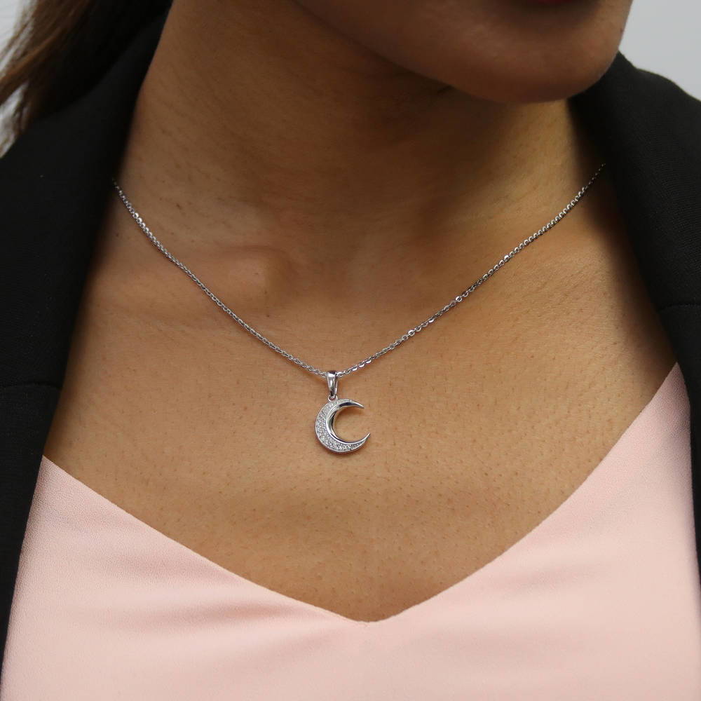 Model wearing Crescent Moon CZ Pendant Necklace in Sterling Silver, 3 of 9