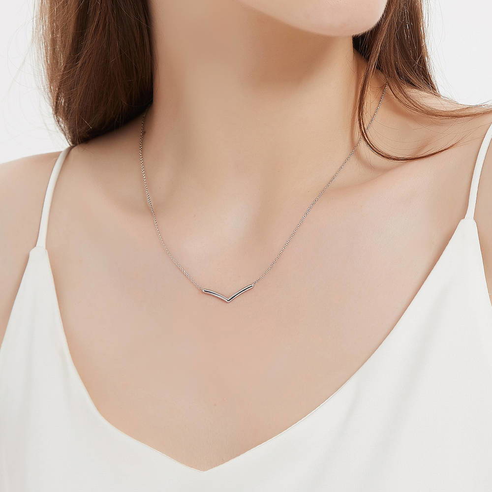 Model wearing Wishbone Chevron V Shaped Necklace in Sterling Silver, 3 of 7