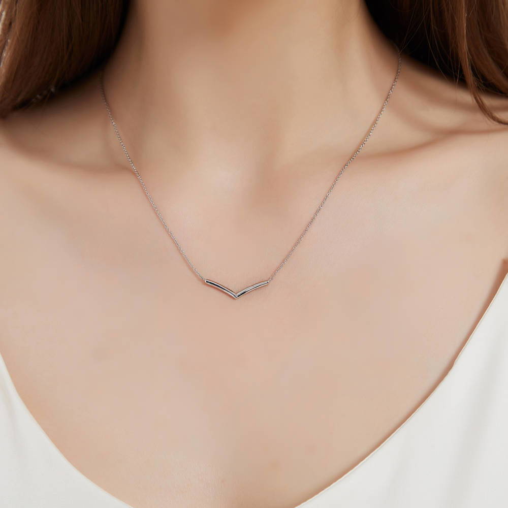 Model wearing Wishbone Chevron V Shaped Necklace in Sterling Silver, 2 of 7