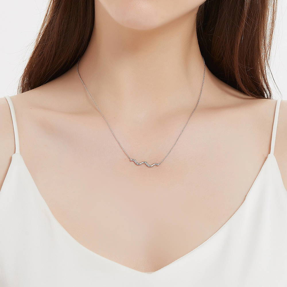 Model wearing Wave Pendant Necklace in Sterling Silver, 3 of 7