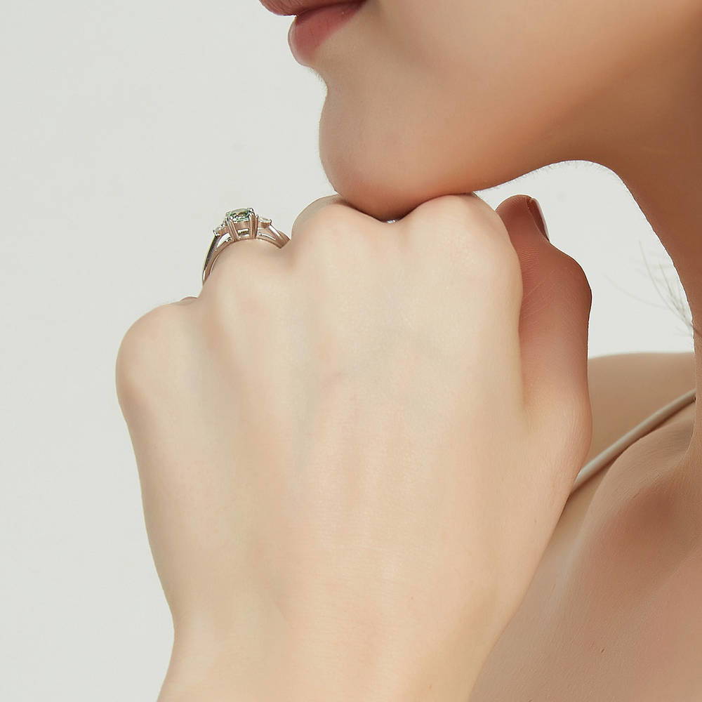 Model wearing 3-Stone Green Round CZ Ring in Sterling Silver, 7 of 9