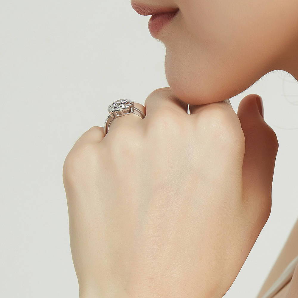 Model wearing Woven Solitaire Bezel Set CZ Ring in Sterling Silver, 7 of 9