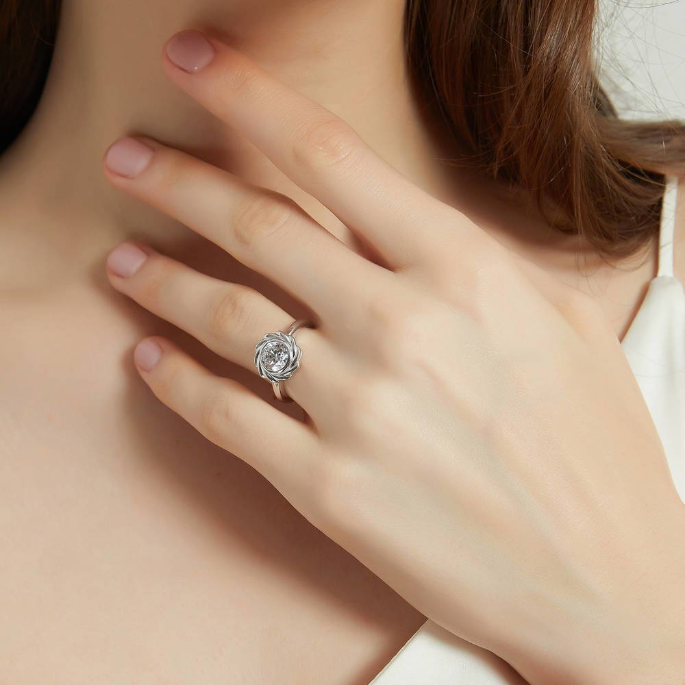 Model wearing Woven Solitaire Bezel Set CZ Ring in Sterling Silver, 2 of 9