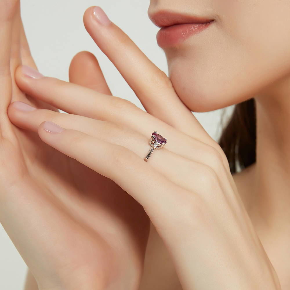 Model wearing 3-Stone 1.2ct Purple Oval CZ Ring in Sterling Silver, 3 of 9