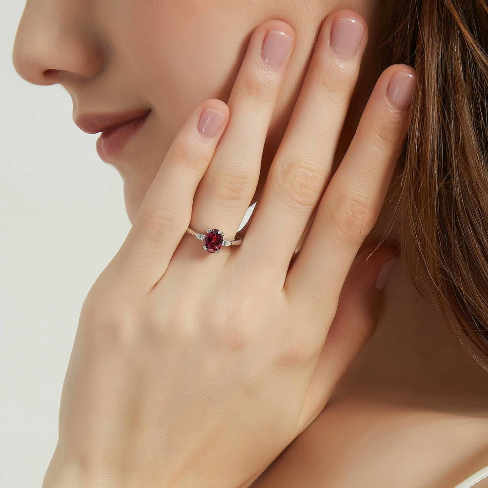 Model wearing 3-Stone Red Oval CZ Ring in Sterling Silver, 6 of 9