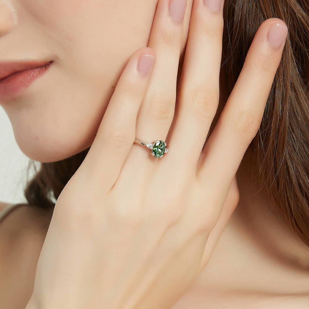 Model wearing 3-Stone 1.2ct Green Oval CZ Ring in Sterling Silver, 2 of 9