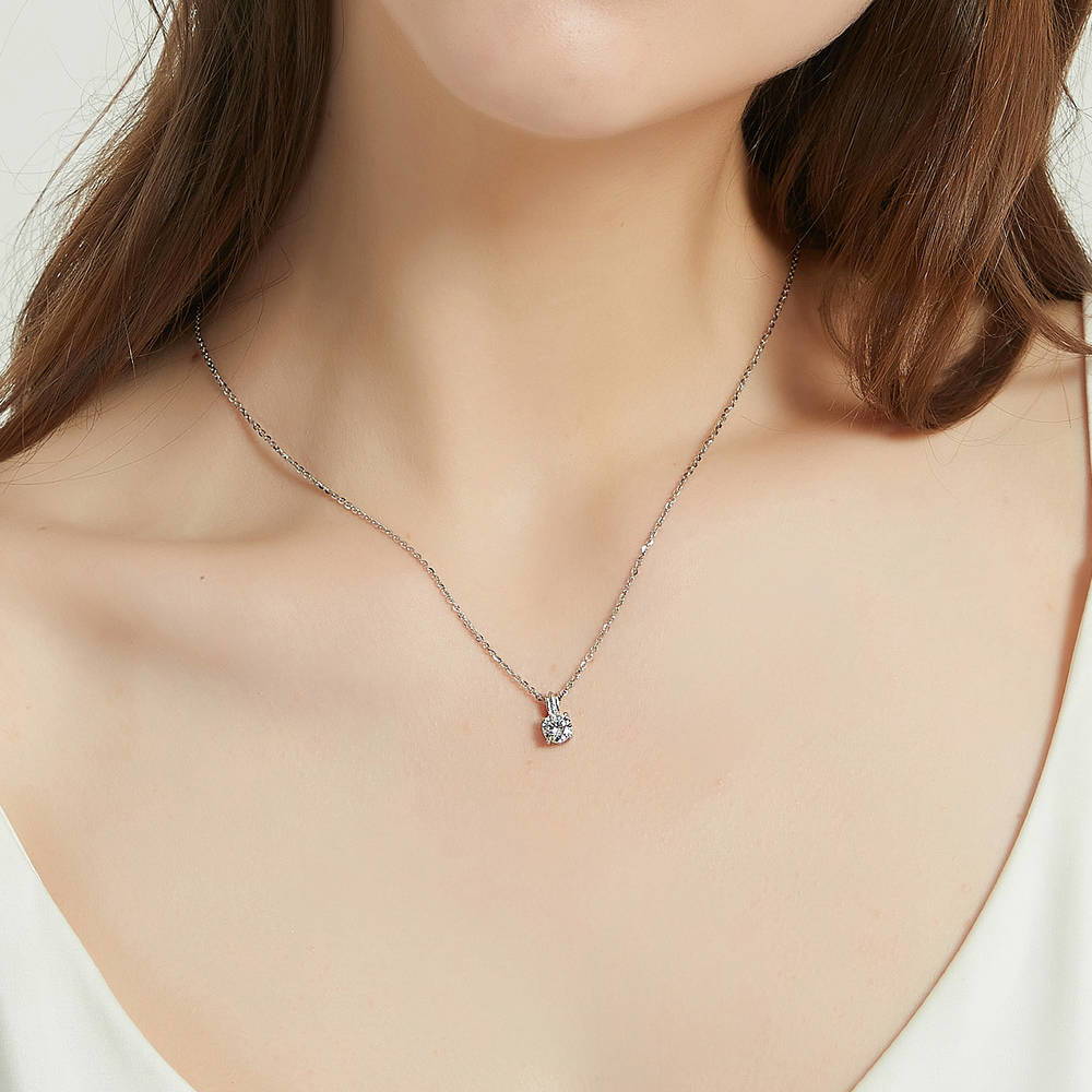 Model wearing Solitaire 0.8ct Round CZ Pendant Necklace in Sterling Silver, 3 of 6