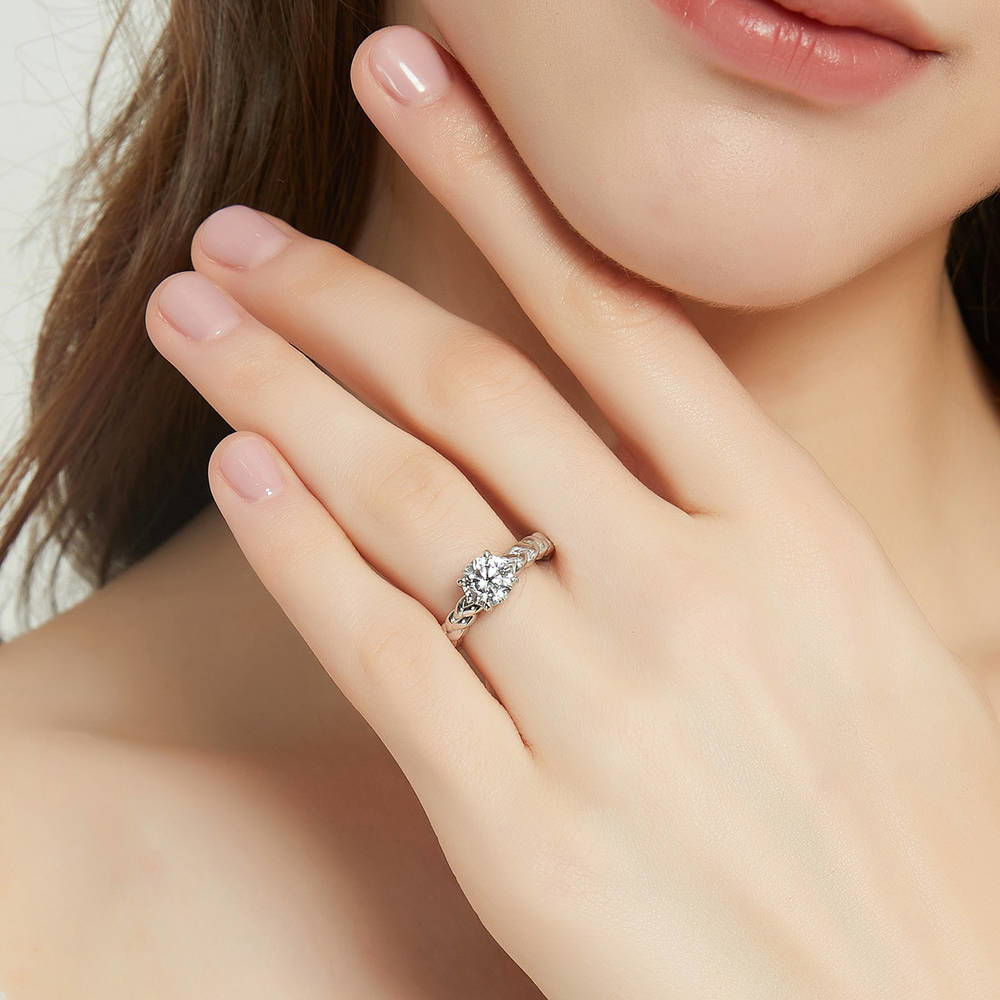 Model wearing Solitaire Woven 1.25ct Round CZ Ring Set in Sterling Silver, 9 of 17