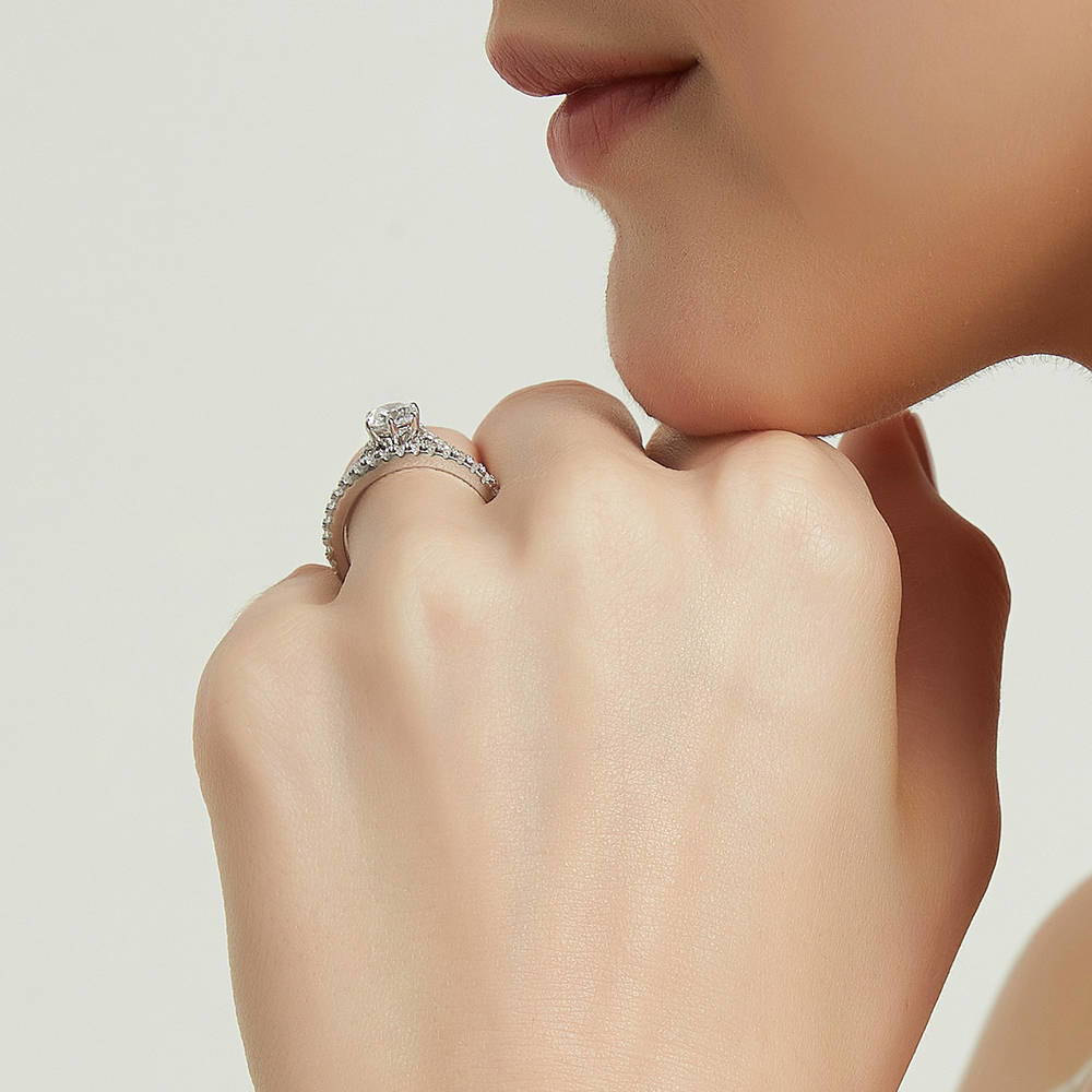 Model wearing Solitaire 0.8ct Round CZ Ring Set in Sterling Silver, 8 of 14