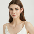 Model wearing Kaleidoscope Solitaire 0.8ct CZ Necklace in Sterling Silver, Red Orange Color