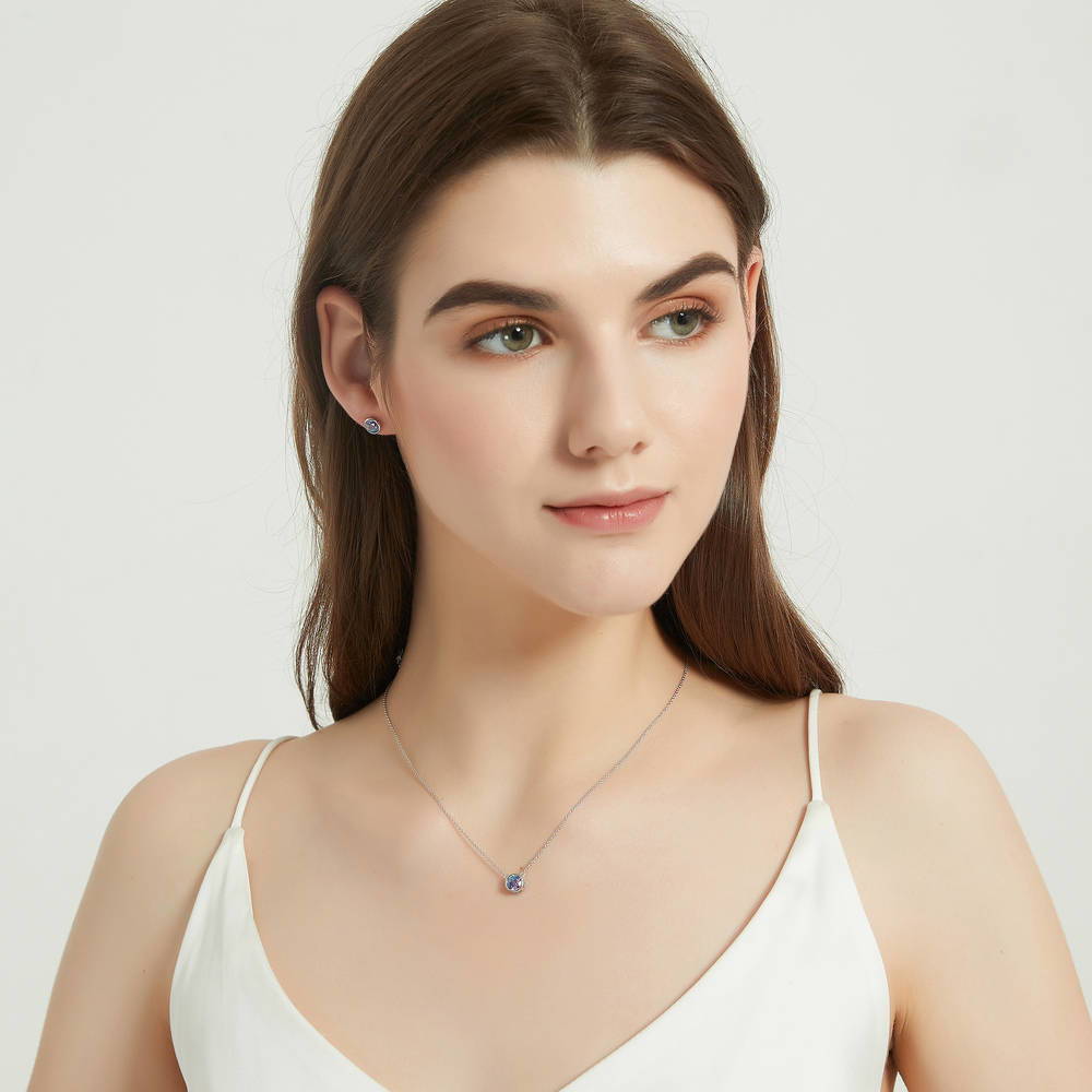 Model wearing Solitaire Bezel Set Round CZ Pendant Necklace in Sterling Silver 0.8ct, 12 of 16