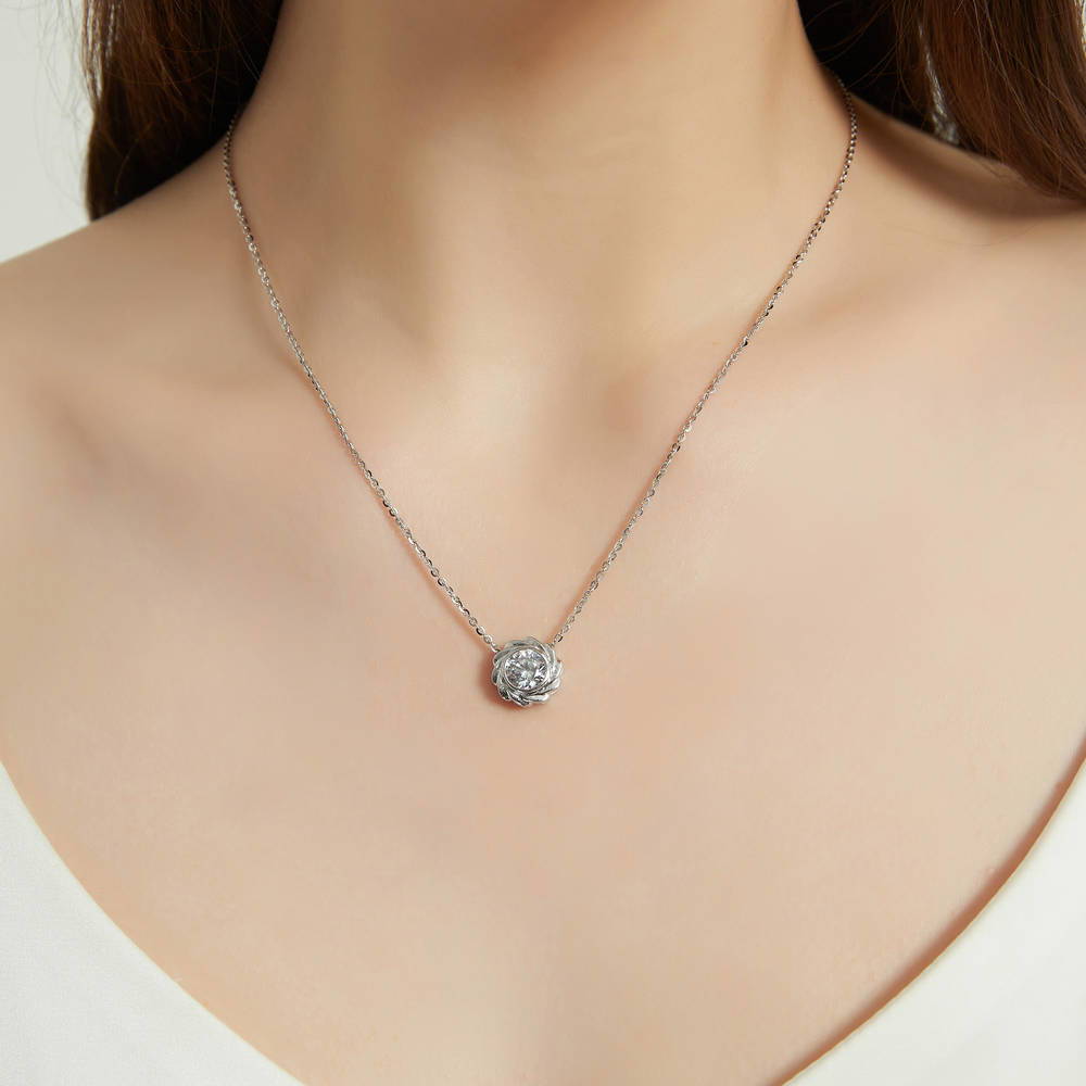 Model wearing Woven Solitaire Bezel Set CZ Pendant Necklace in Sterling Silver, 2 of 7