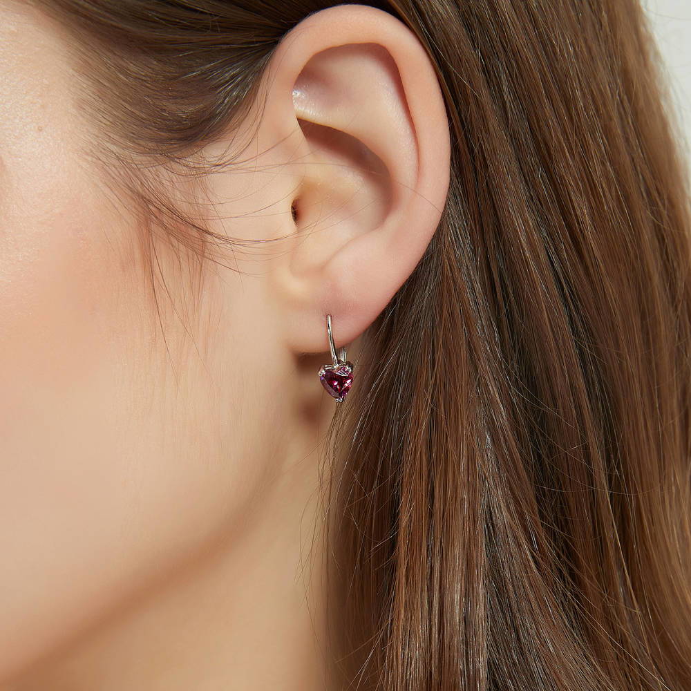 Model wearing Solitaire Red Heart CZ Leverback Earrings in Sterling Silver 1.4ct, 2 of 4